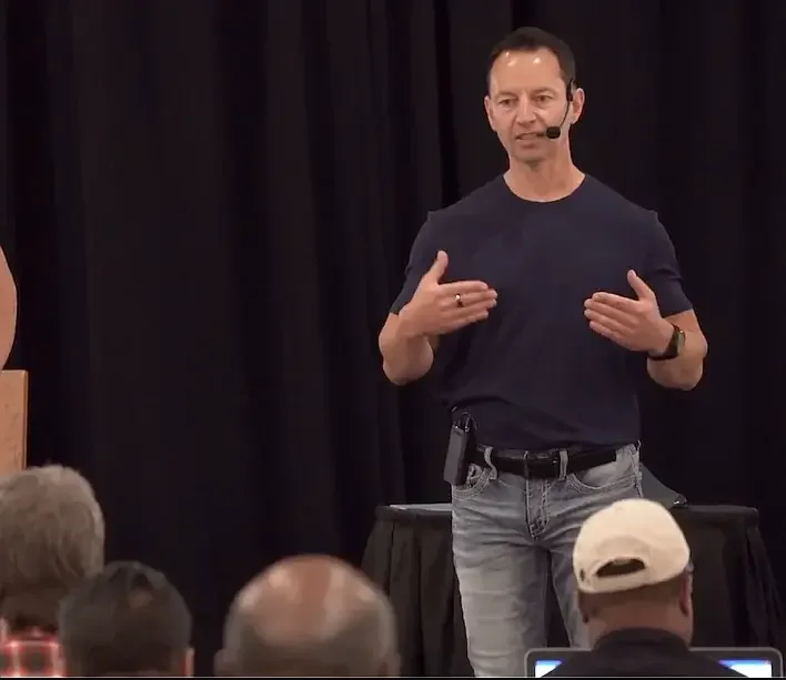David Corbaley teaching on stage
